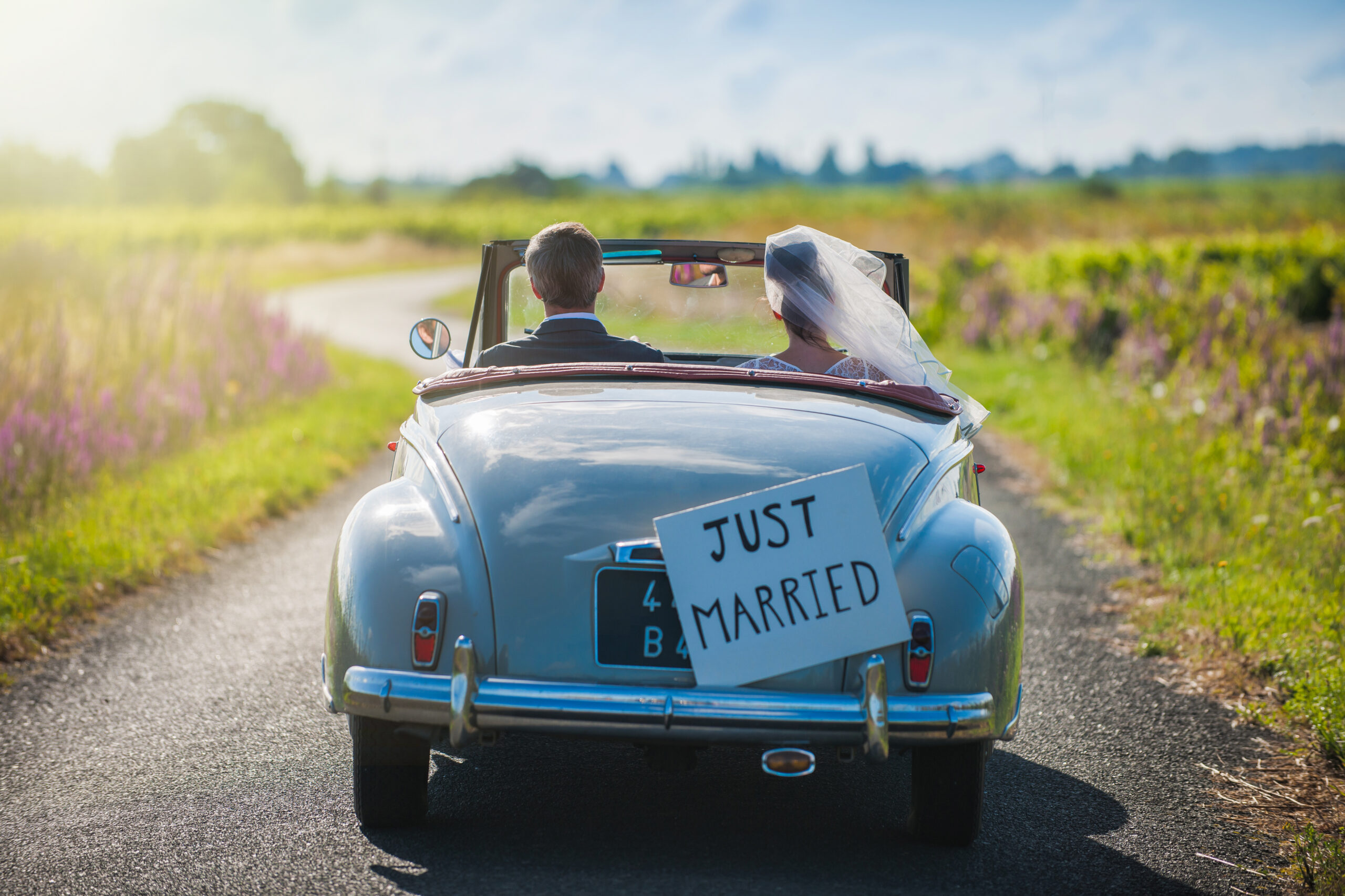 health insurance when you're married, health insurance for couples, A,Newlywed,Couple,Is,Driving,A,Convertible,Retro,Car,On