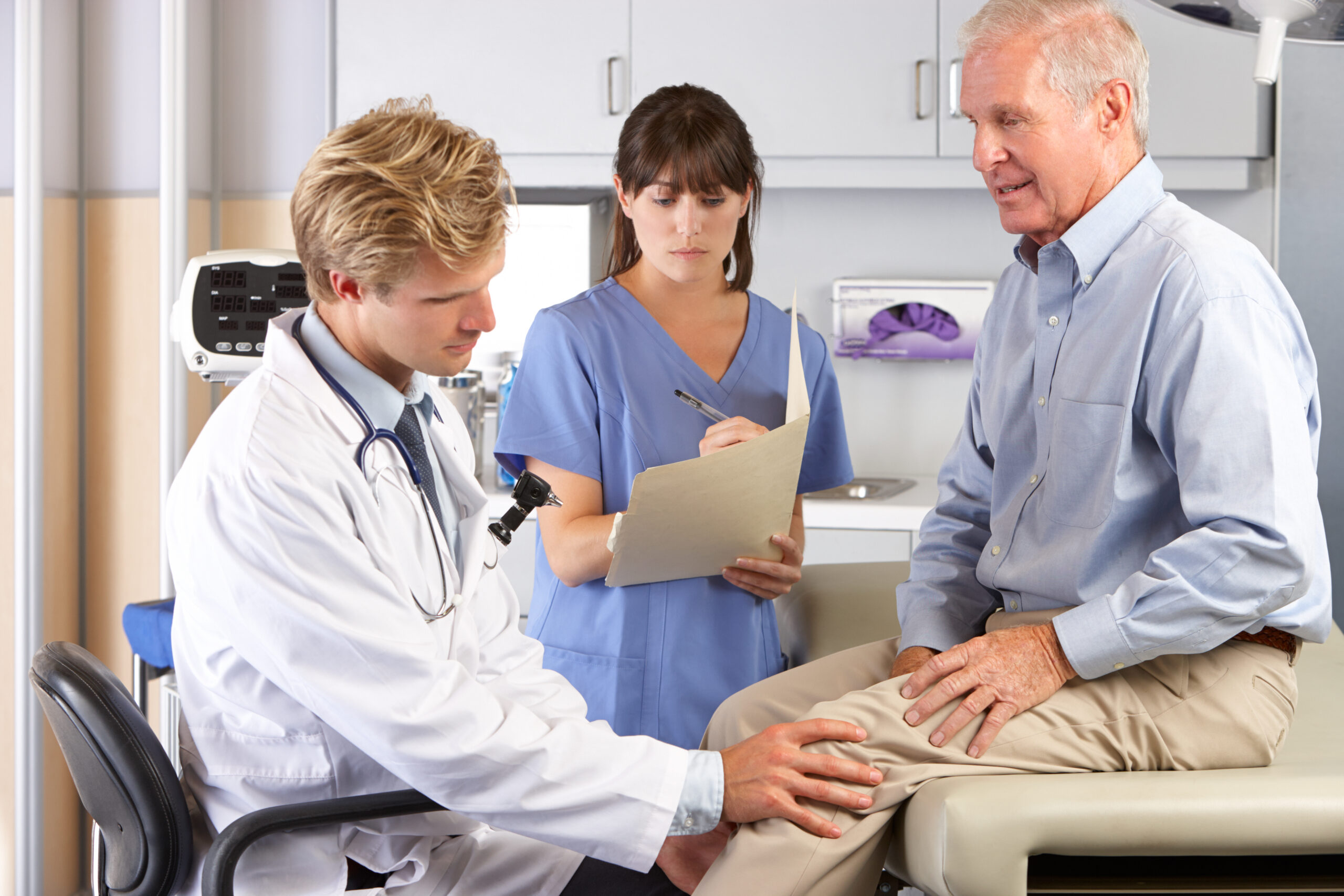health insurance and knee replacements, Doctor,Examining,Male,Patient,With,Knee,Pain, knee replacement surgery