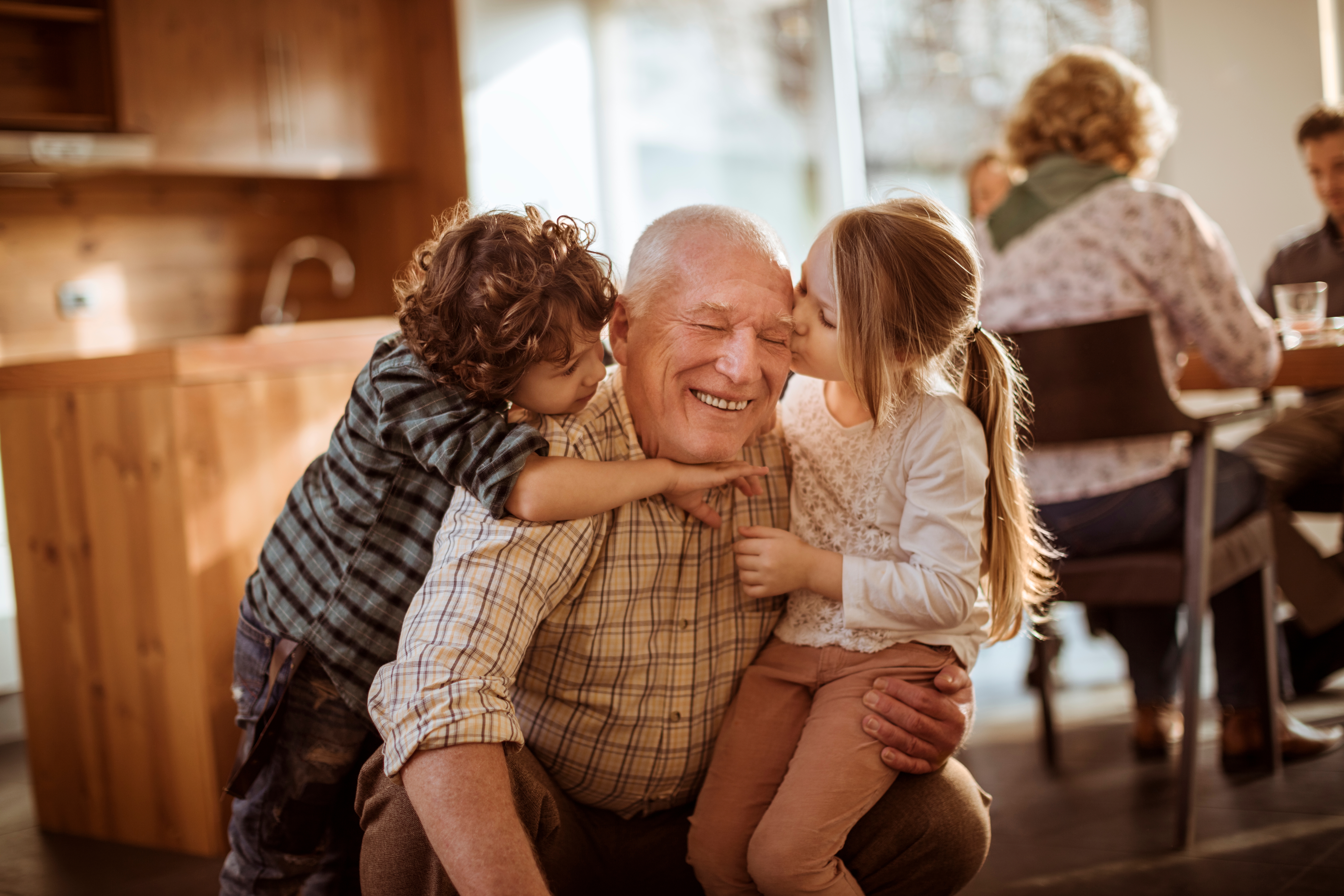 Grandfather,Spending,Time,With,His,Grandchildren,At,Home