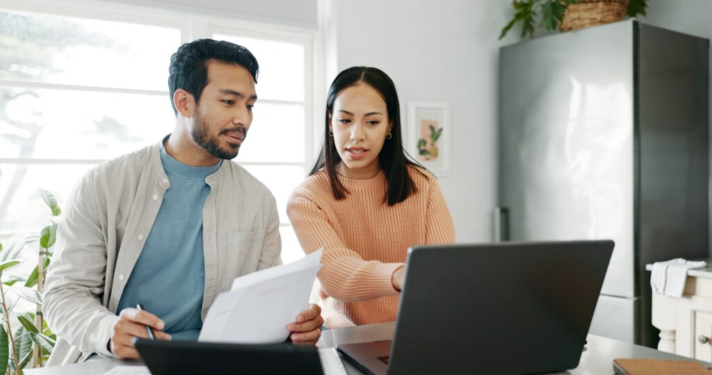 Happy,Couple,,Paperwork,And,Technology,For,Savings,,Paying,Bills,Or